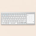 Teclado inalámbrico blanco con touchpad numérico