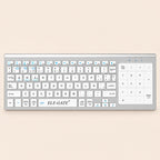Teclado inalámbrico blanco con touchpad numérico